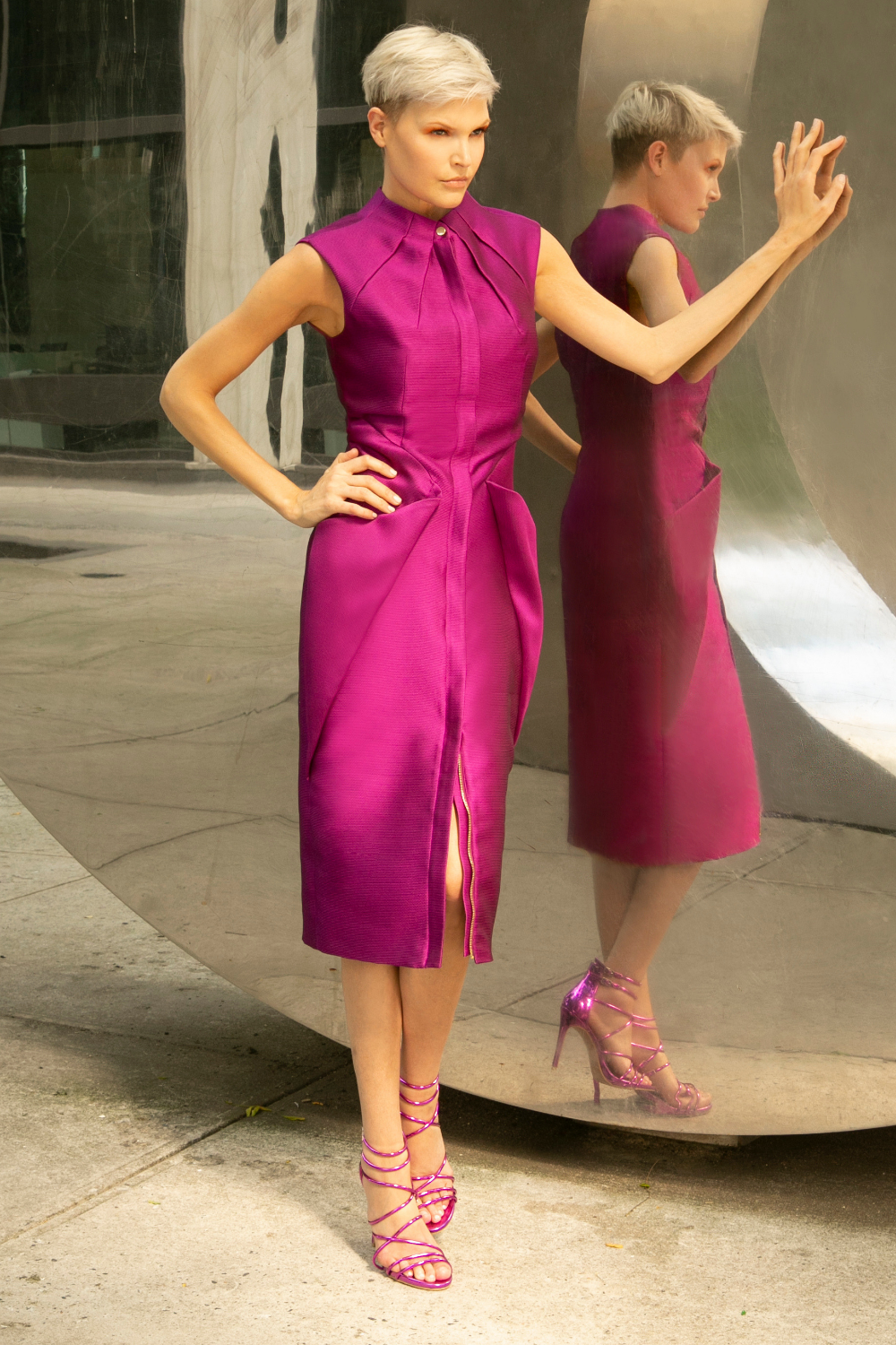 Rasberry purple sleeveless midi cocktail party dress with two-way gold zipper and adjustable front slit. The dress has a straight fit with a round high neck  and side pockets