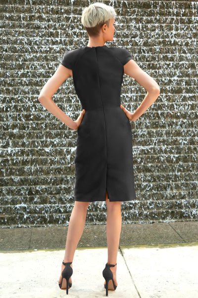 Short formal black dress with oragami style cap sleeves and centered back slit